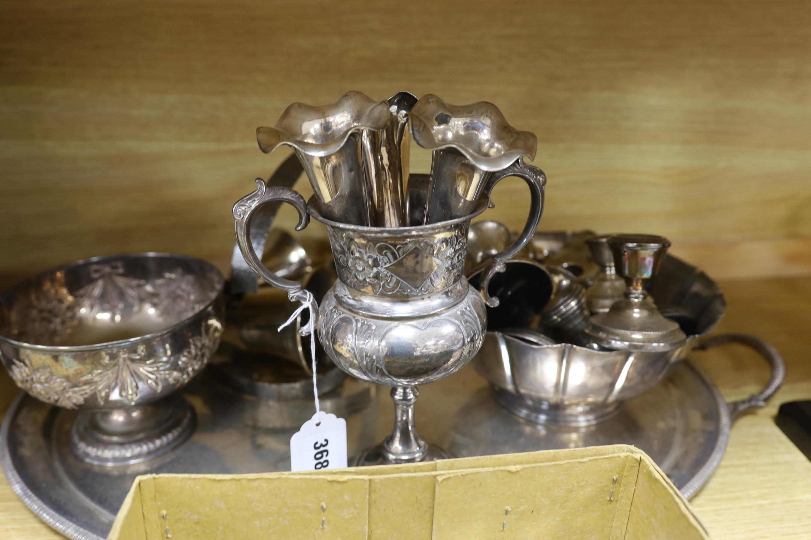 A plated tray, mixed silver and other squat candlesticks, photo frames etc